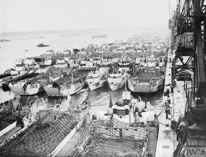 A large group of LCTs (Landing Craft Tank) moored along the quayside at Southampton, 1944.